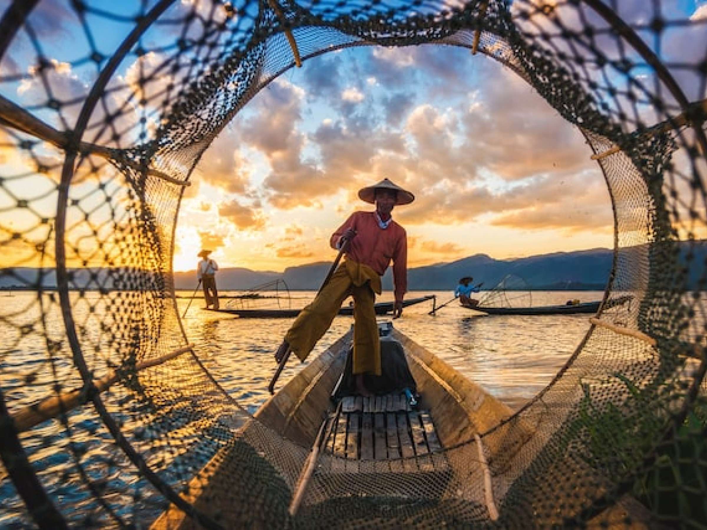 fishermen at sunset in Myanmar 