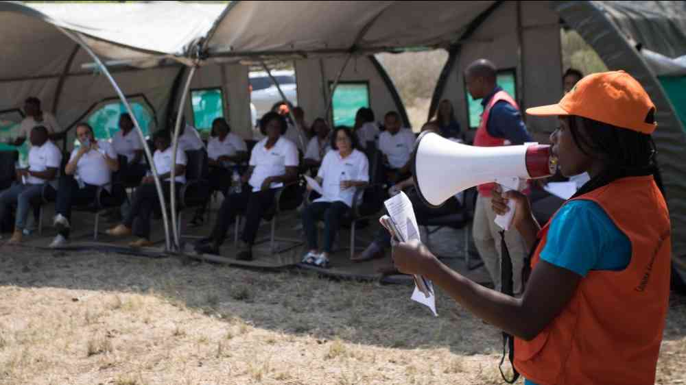 person using a loudspeaker, mozambique