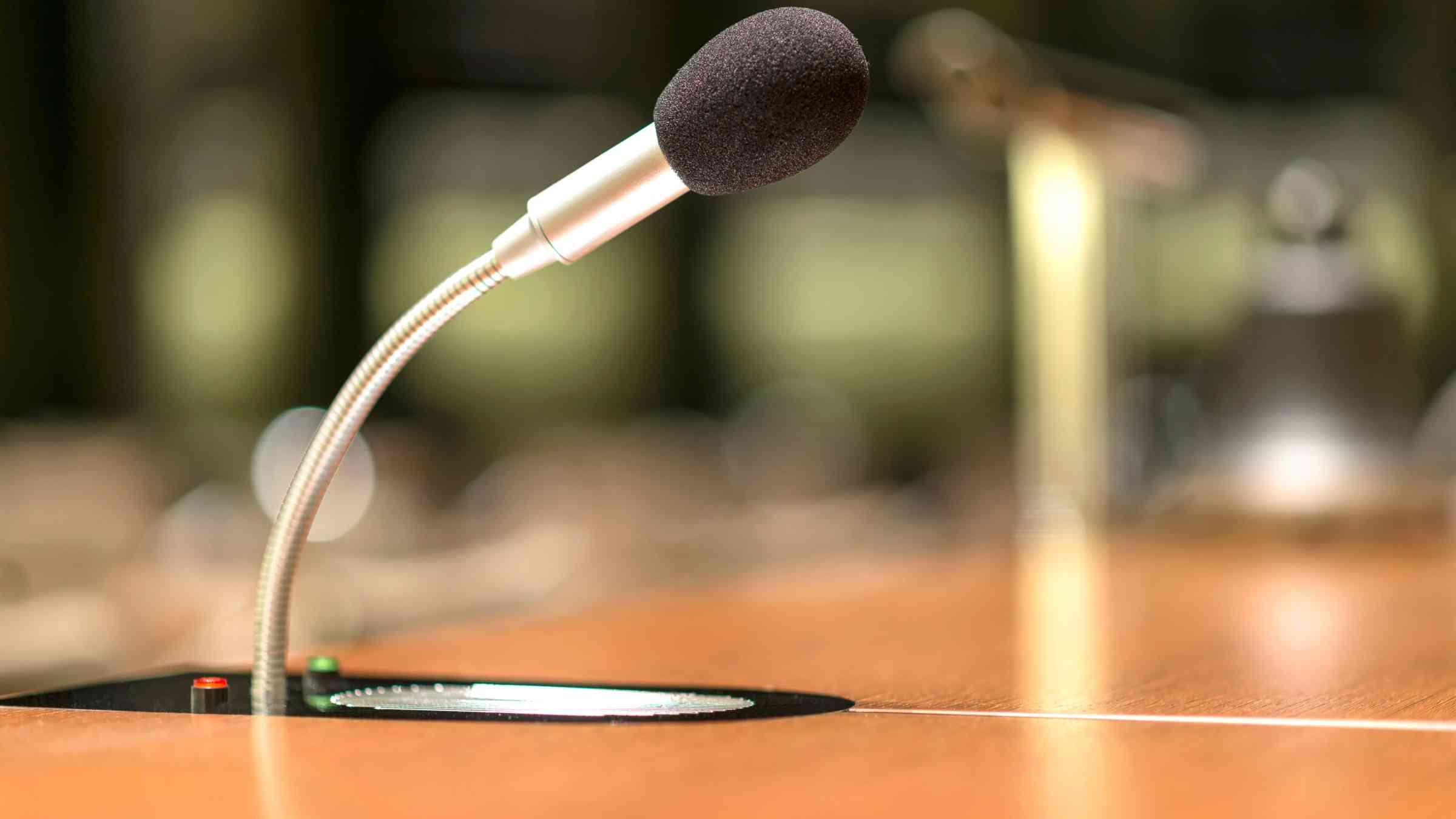 Isolated view of a microphone in a conference room.png