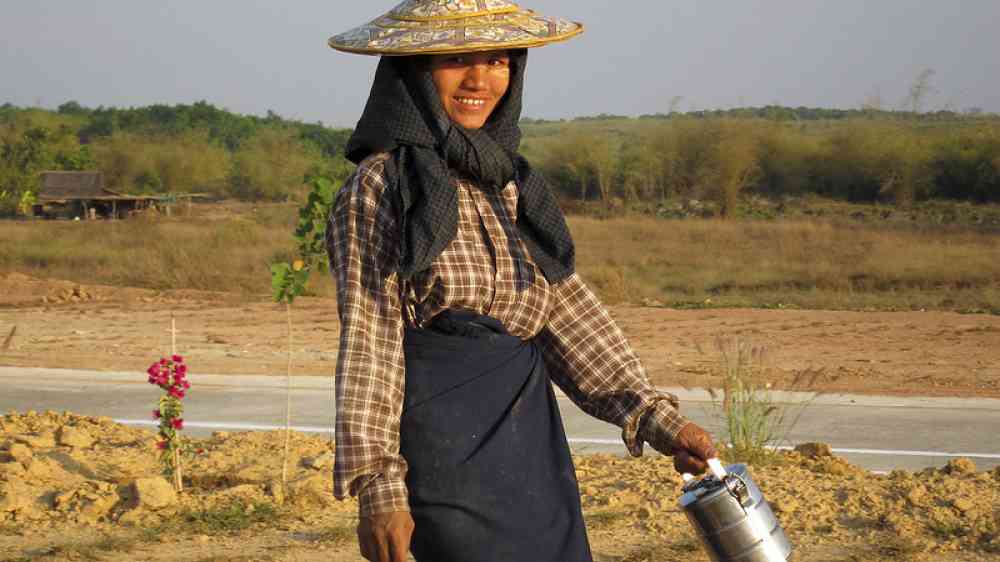 Walking home from work along the road from Naypyitaw. Naypyitaw, Myanmar