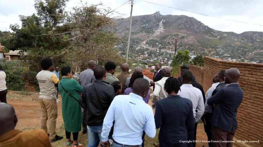 Group of people making an assessment of the landslide area following Cyclone Freddy in Blantyre, Malawi 