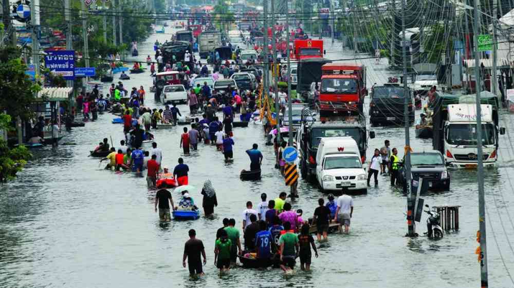 People walking in a flooded road