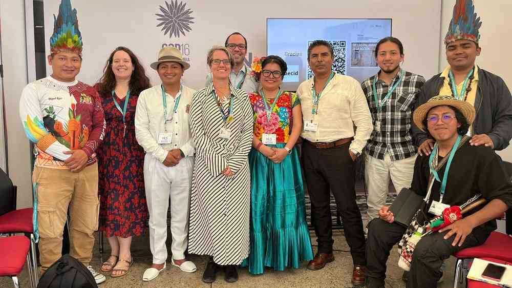 group photo of people wearing indigenous clothes