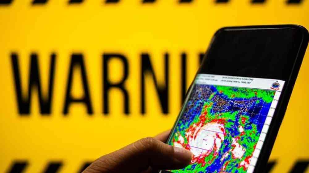 person checking a weather map on a smartphone